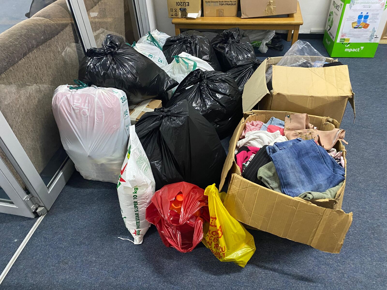 Boxes and bags of donated clothing for the Beanie and Blanket Drive