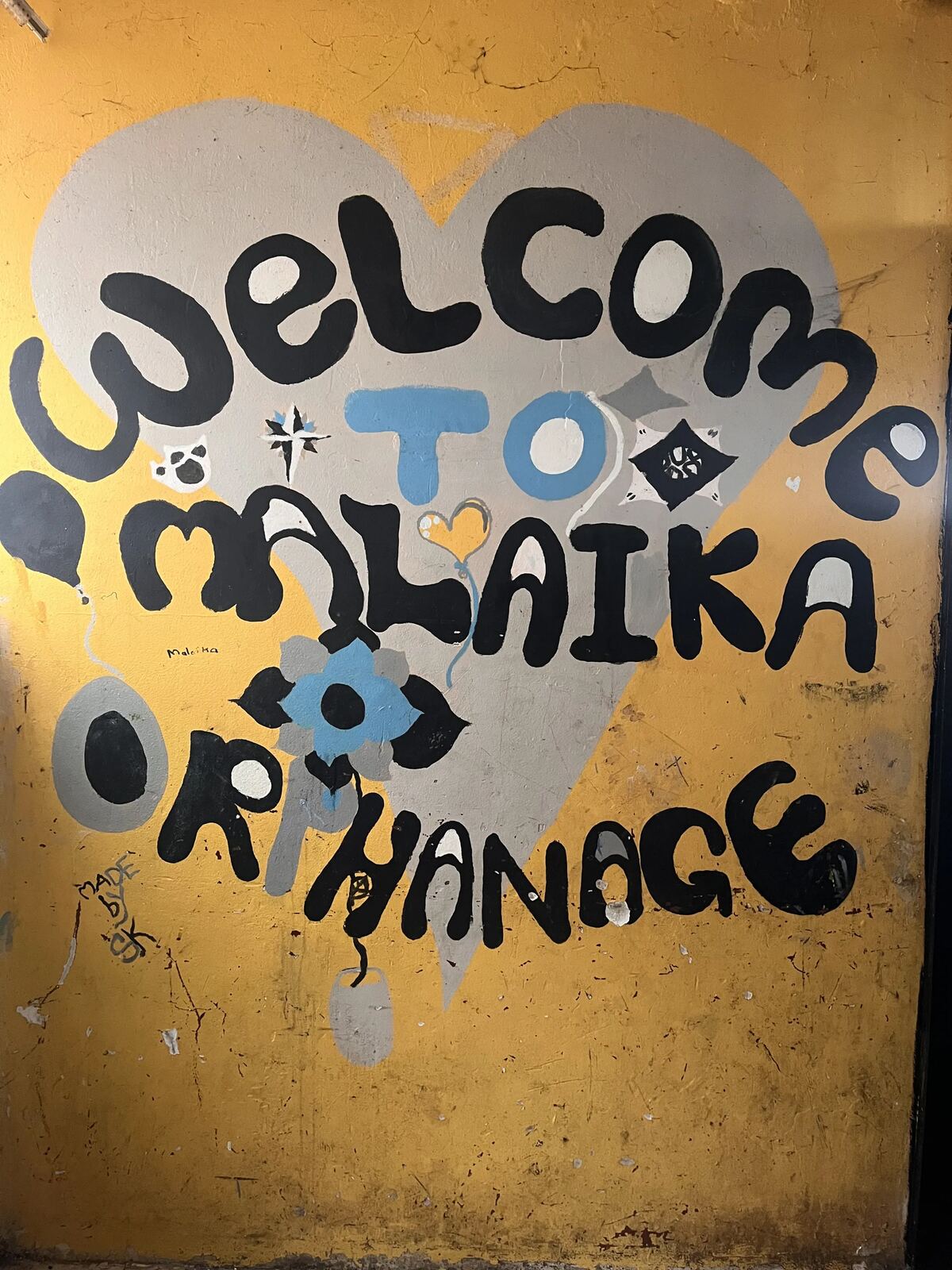 Welcome to Malaika Orphanage, hand-painted sign